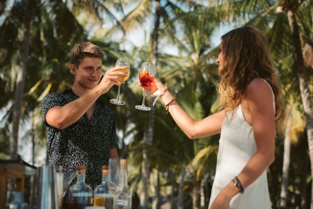 Oceanica Resort Panglao, Bohol Екстер'єр фото Two people toasting with wine